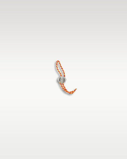 official white decorative watch hangtag with a bright orange string representing the Poinçon de Genève hallmark