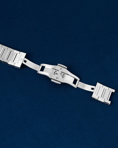 Detailed view of the open double-folding deployment buckle clasp on a steel Zenith Defy Skyline bracelet