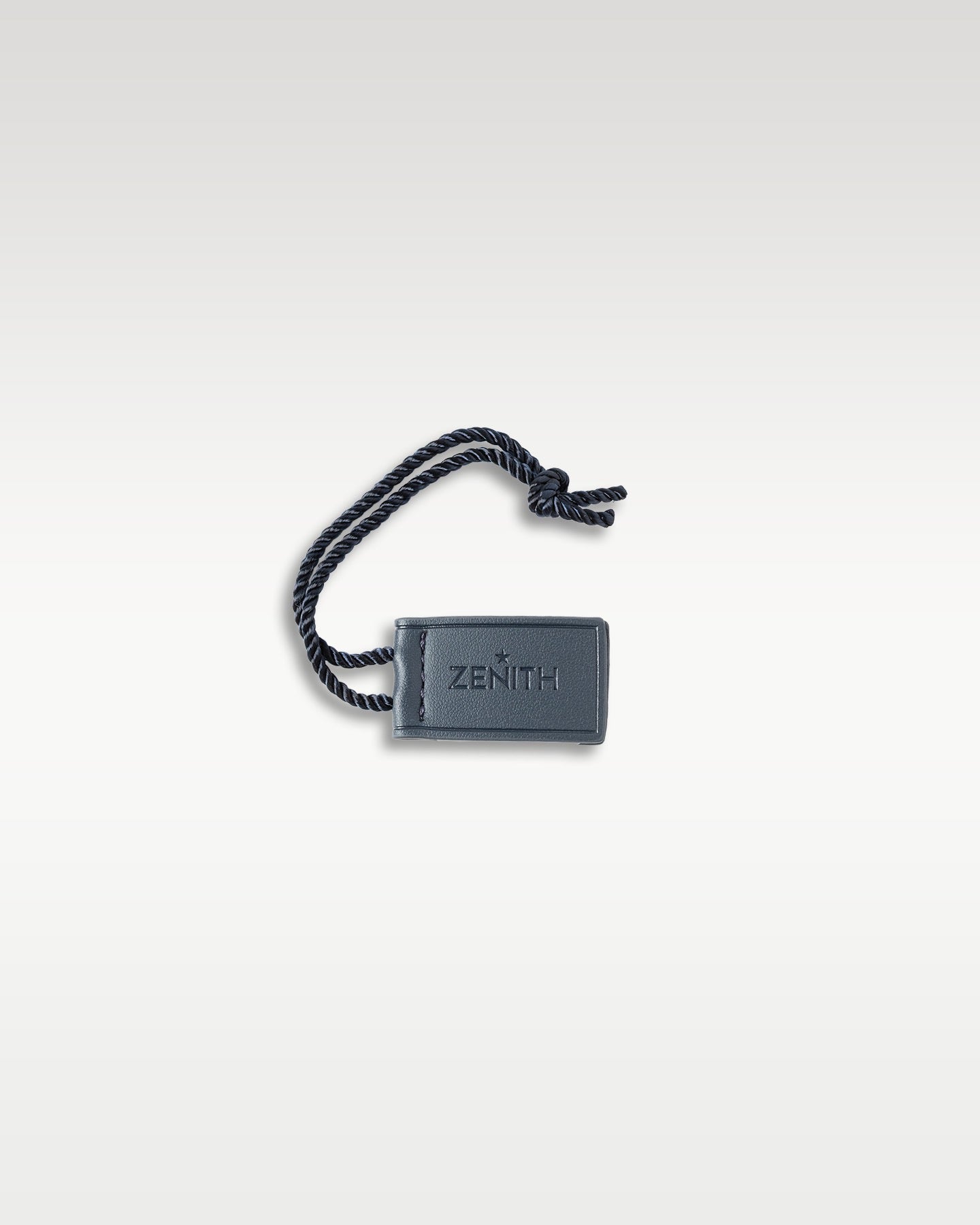 Official rectangular black plastic Zenith brand retail price and serial hang tag with cord