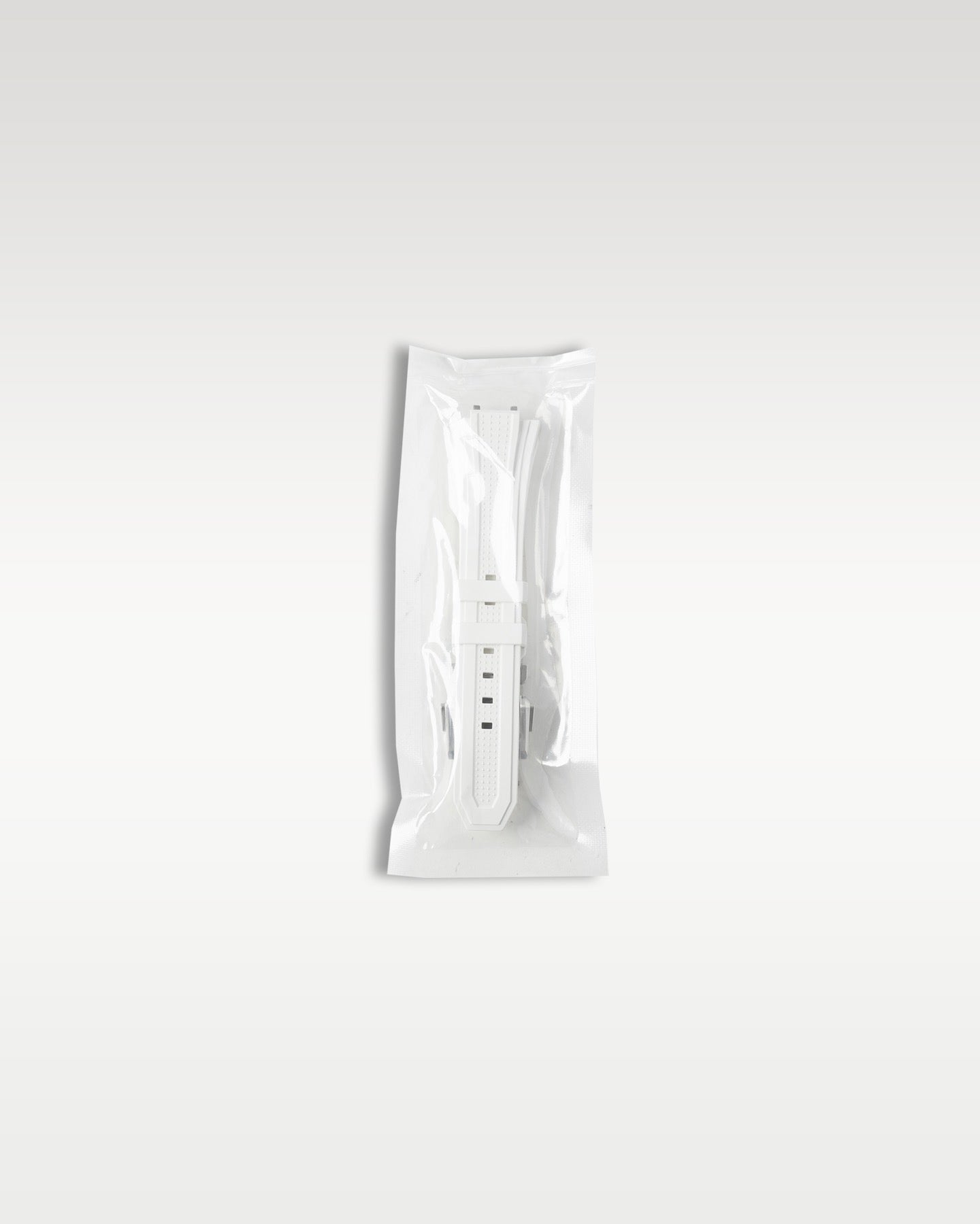Included secondary white patterned rubber strap factory sealed in original plastic packaging for the Zenith quick-change system