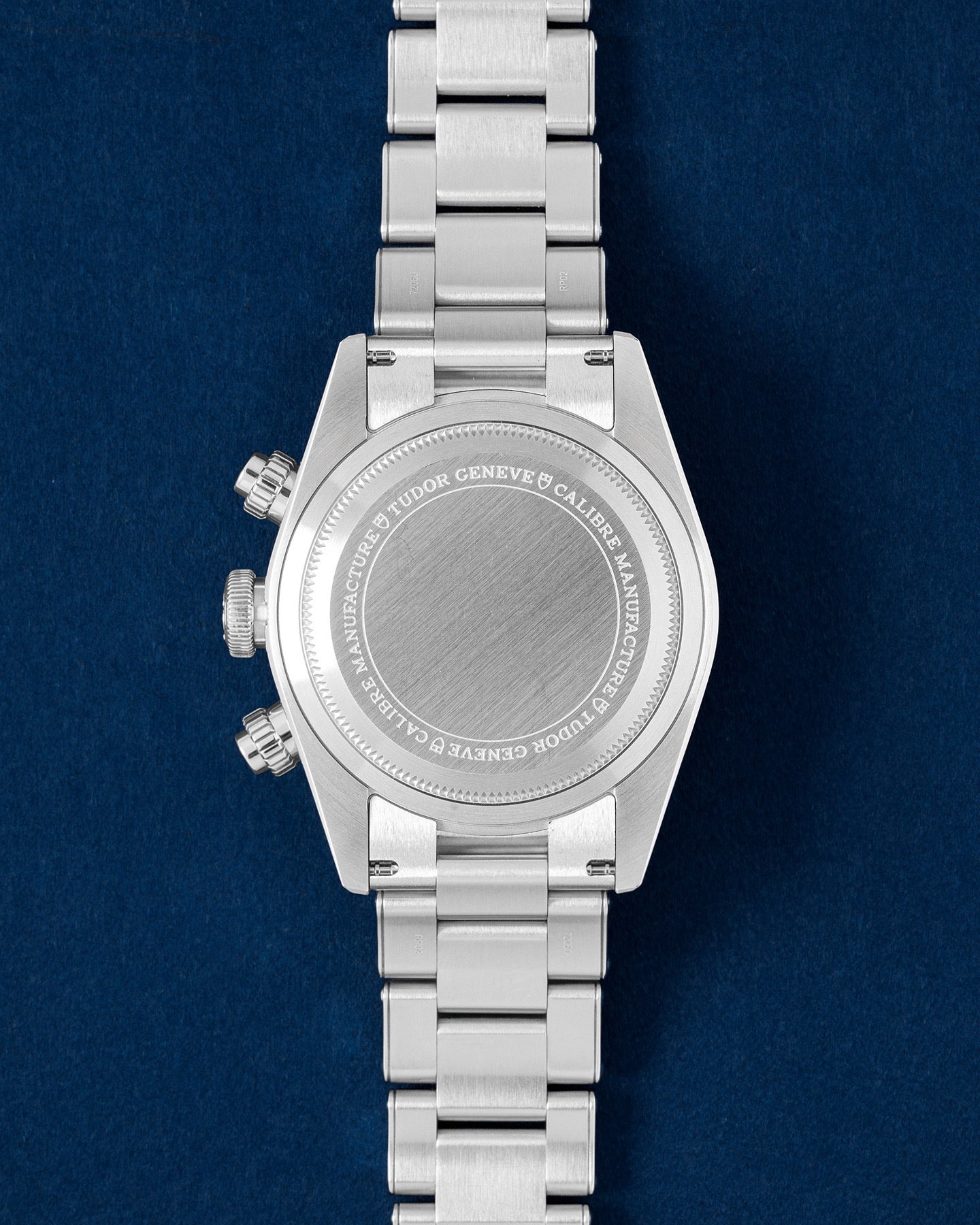 The solid satin-finished stainless steel screw-down caseback on a Tudor Black Bay Chronograph