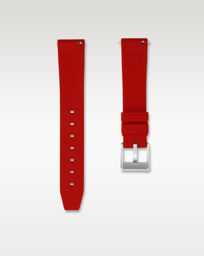 Underside view of WISSTRAPS 18mm scarlet red quick release rubber watch strap showing logo and quick-release spring bars