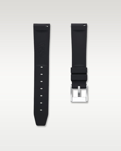 Underside view of WISSTRAPS 18mm tuxedo black quick release rubber watch strap showing logo and quick-release spring bars