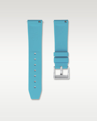 Underside view of WISSTRAPS 22mm miami blue quick release rubber watch strap showing logo and quick-release spring bars