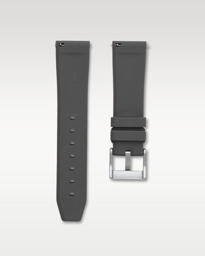 Underside view of WISSTRAPS 24mm charcoal grey quick release rubber watch strap showing logo and quick-release spring bars