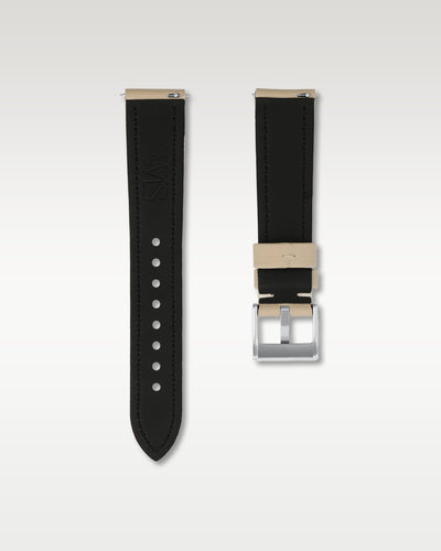 Reverse side of a beige 20mm watch band revealing the black inner lining, integrated quick-release pins, and engraved WIS hardware
