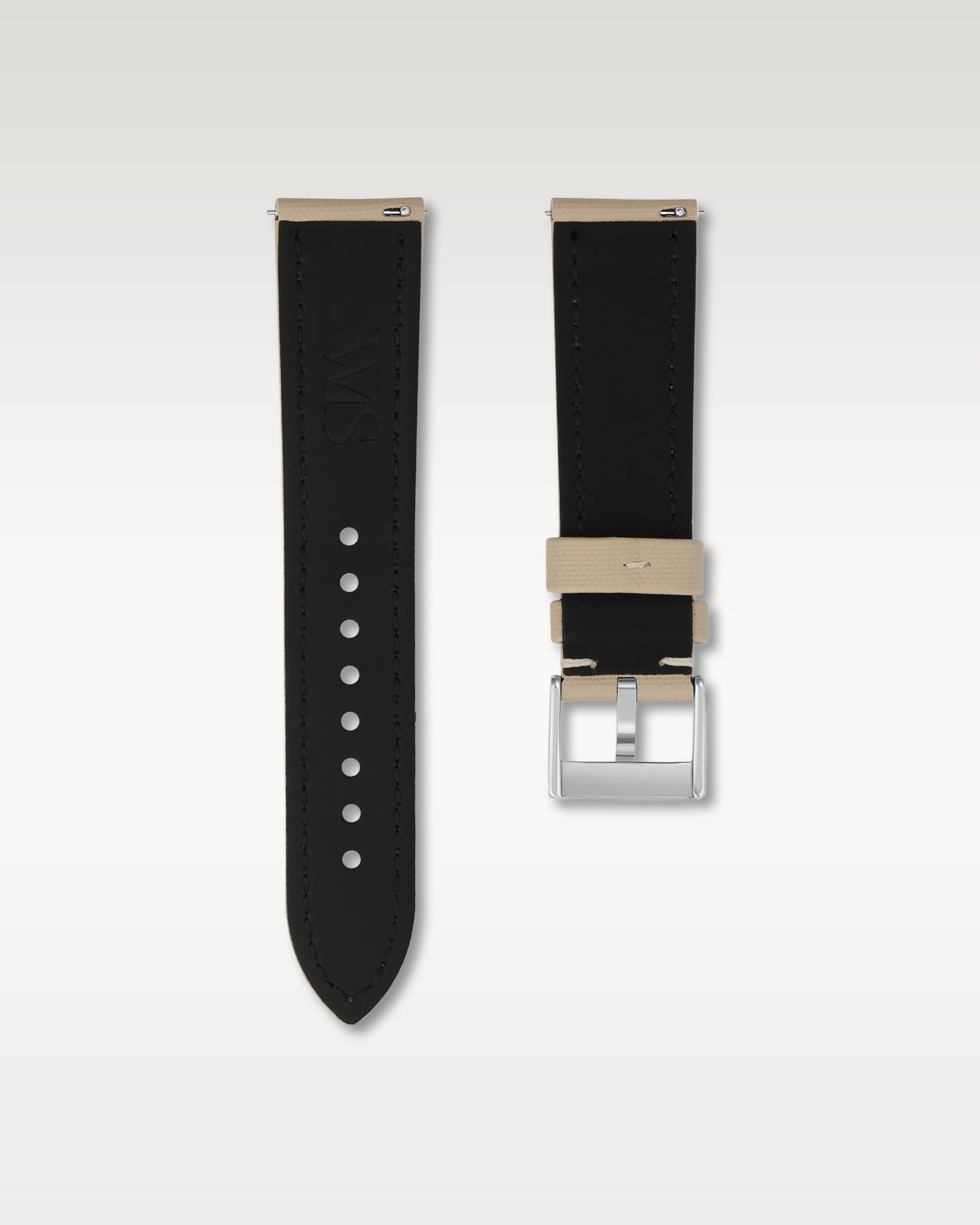 Reverse side view of a 22mm beige sailcloth watch band highlighting the dark lining, quick-release pins, and WIS engraving