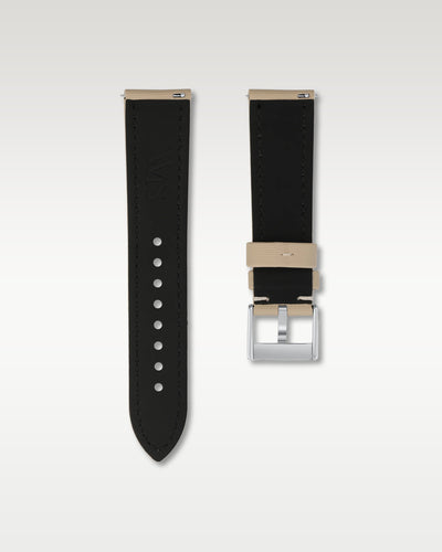 Reverse side view of a 22mm beige sailcloth watch band highlighting the dark lining, quick-release pins, and WIS engraving