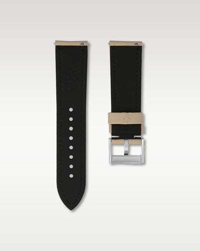 Reverse side view of a 24mm beige sailcloth watch band highlighting the dark lining, integrated quick-release pins, and WIS engraving
