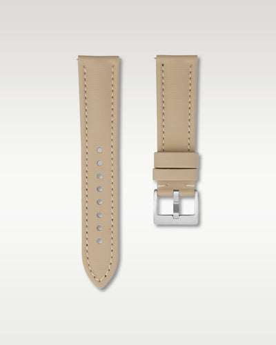 Front view of a 22mm creamy beige sailcloth watch band showing its fine woven texture and brushed silver pin buckle
