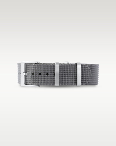 Flat layout view of a steel charcoal grey woven nylon watch strap folded with brushed silver hardware