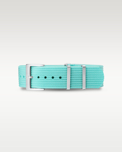 Flat layout view of a steel lagoon blue woven nylon watch strap folded with brushed silver hardware