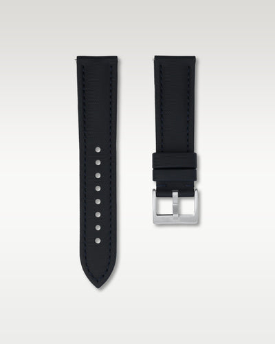 Front layout view of a 22mm deep navy sailcloth watch band highlighting its cross-hatch fabric weave and brushed steel pin buckle