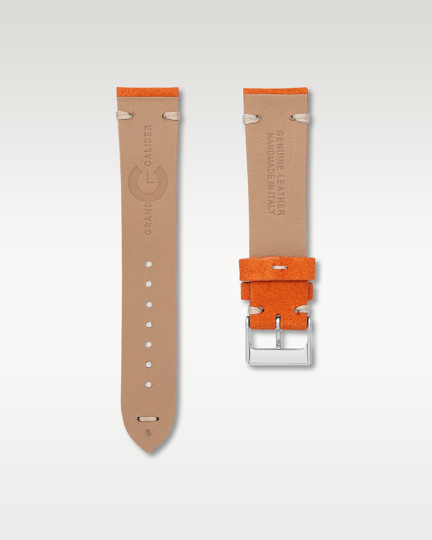 Underside view of WISSTRAPS 20mm Pumpkin Orange suede leather watch strap showing soft tan lining and stamped brand logo