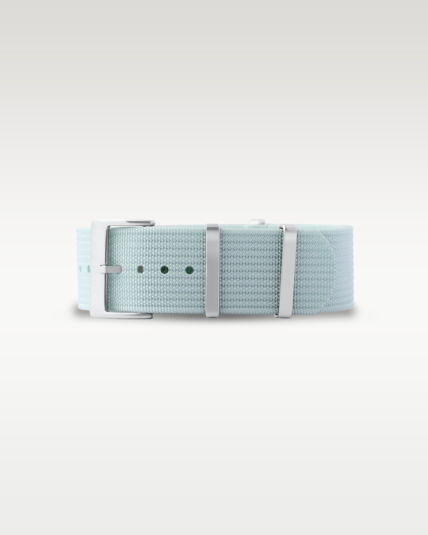 Flat layout view of a muted sage green woven nylon watch strap folded with brushed silver hardware
