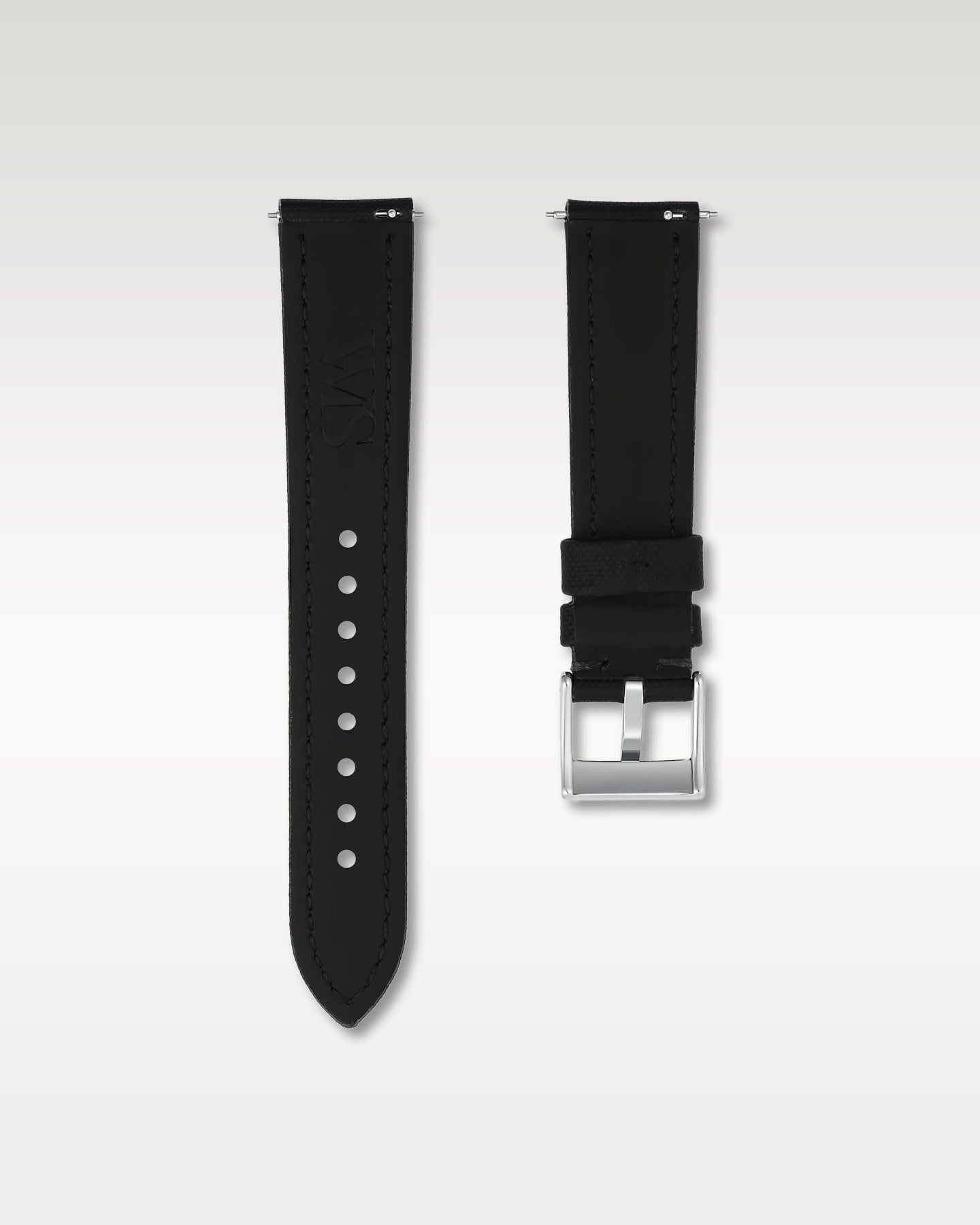 Underside and hardware view showing integrated quick-release push levers and signed WIS pin buckle on black sailcloth
