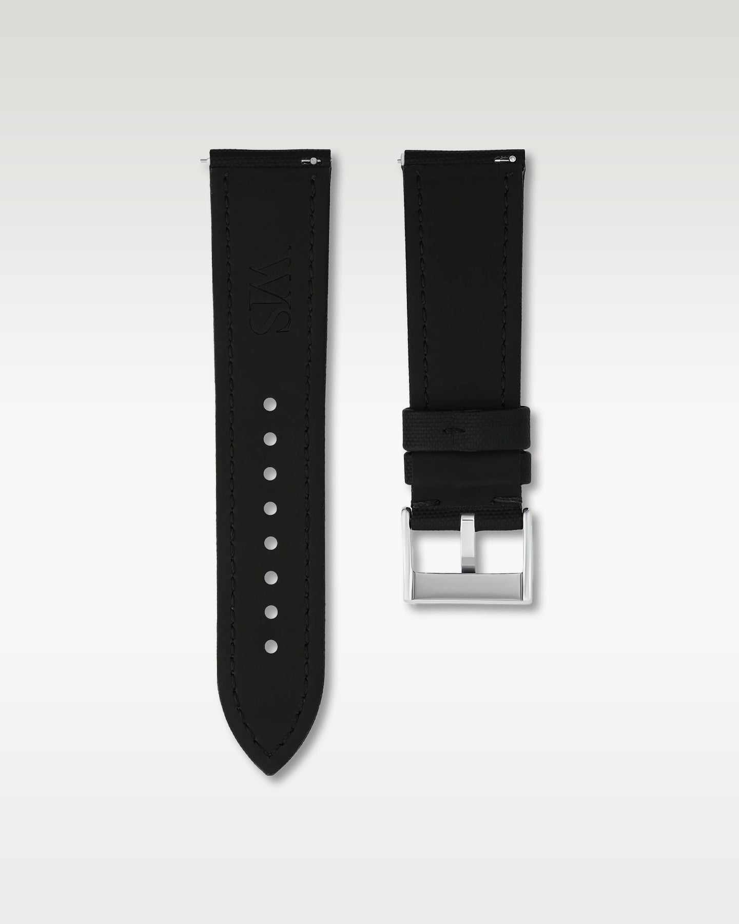 Reverse side view of a 24mm black sailcloth watch strap showing integrated quick-release spring levers, dark lining, and engraved WIS buckle